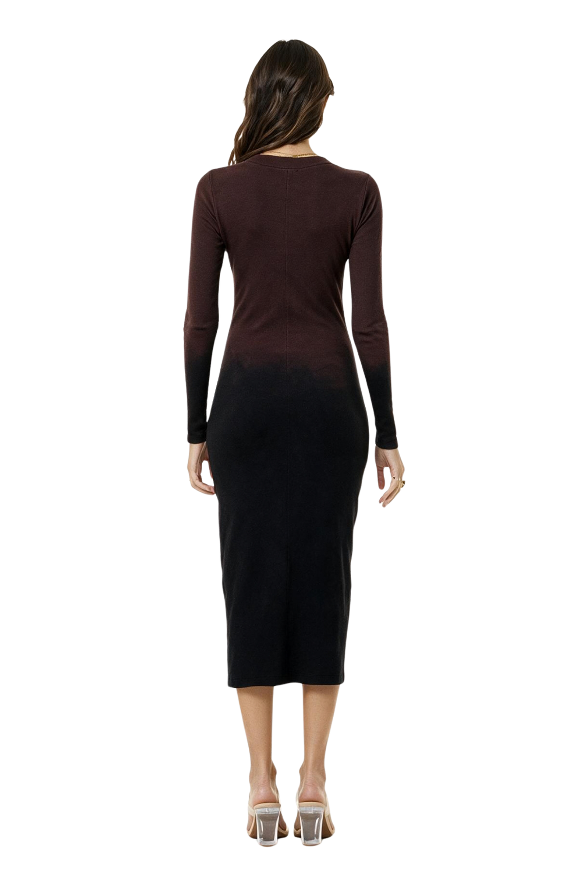 A woman modeling the backside of a  long-sleeve midi dress with a dark brown to black ombre gradient, paired with clear high-heeled sandals, against a plain white background.