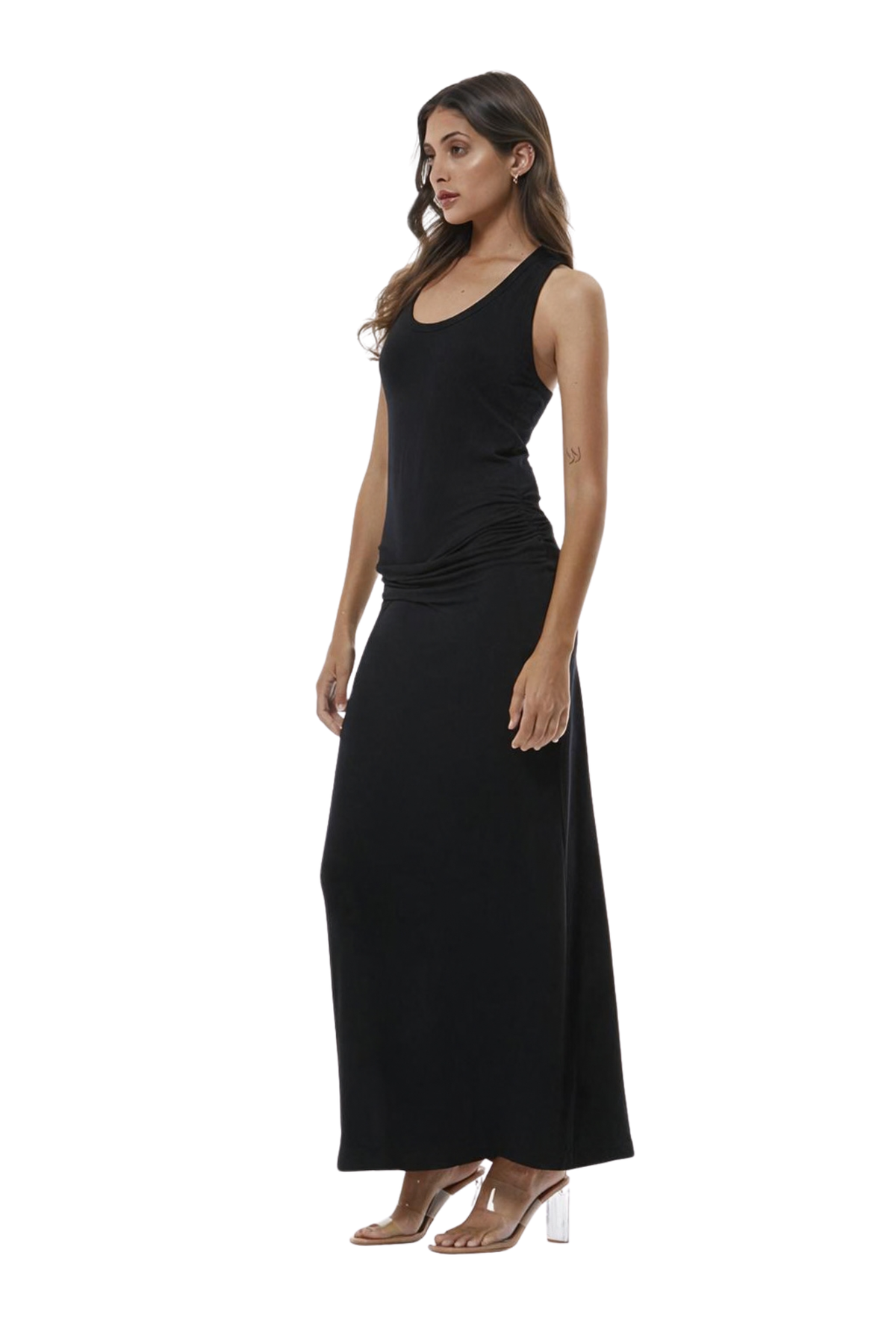 A woman modeling a sleeveless black maxi dress with a gathered waist detail, shown in profile against a plain white background.