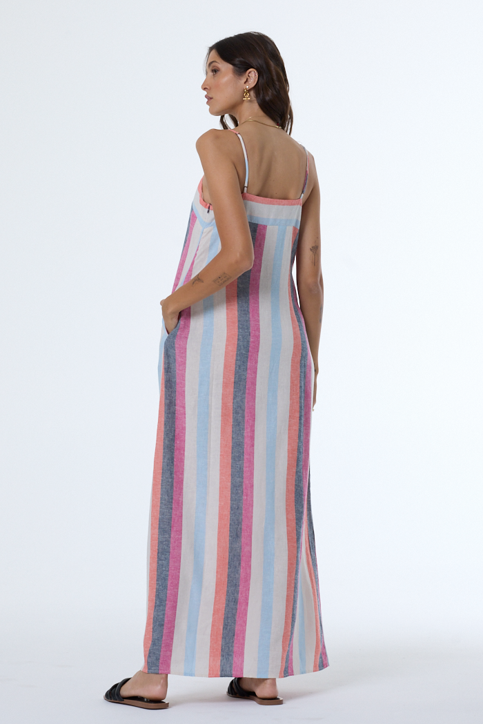 Woman wearing a striped dress on a white background