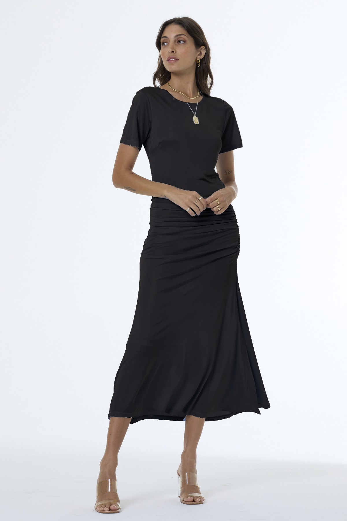 Woman wearing a black dress on a white background
