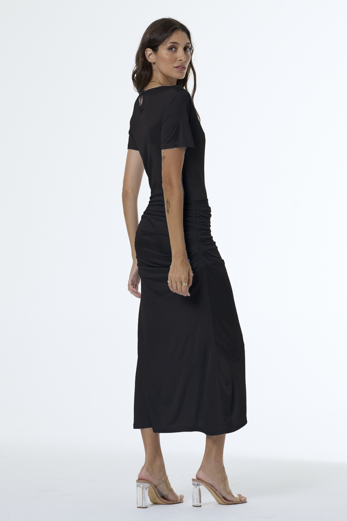 Woman wearing a black dress on a white background