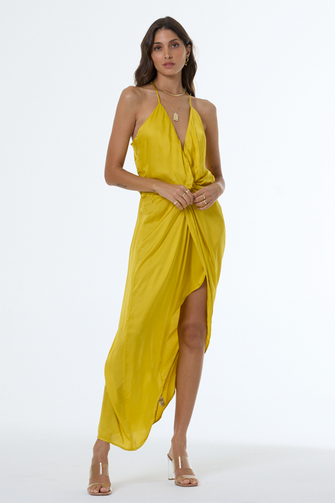 Woman wearing a yellow dress on a white background