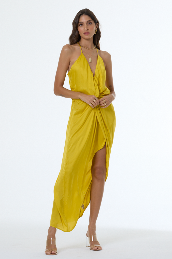 Woman wearing a yellow dress on a white background