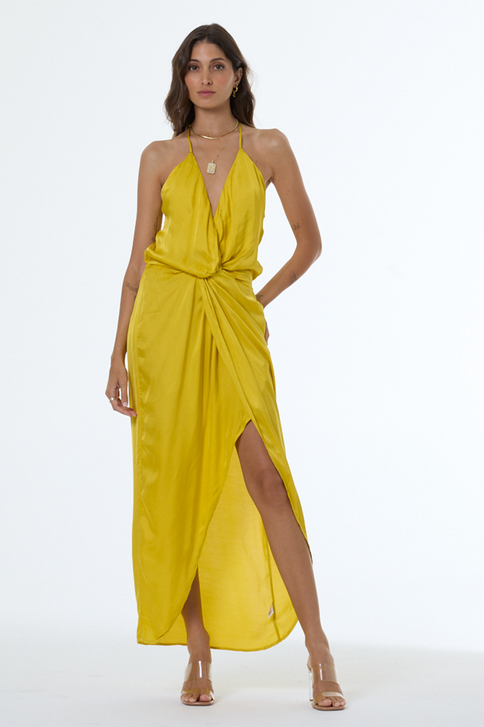 Woman wearing a yellow dress with a white background