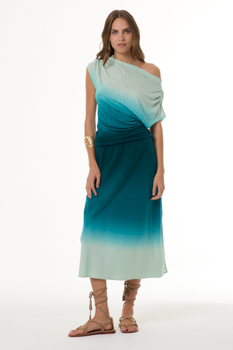 Woman wearing a gradient dress with one shoulder on a white background