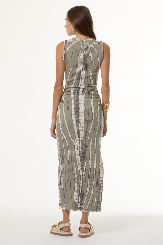 Woman wearing a patterned dress on a white background