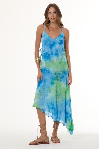 Woman wearing a blue and green tie-dye dress on a white background