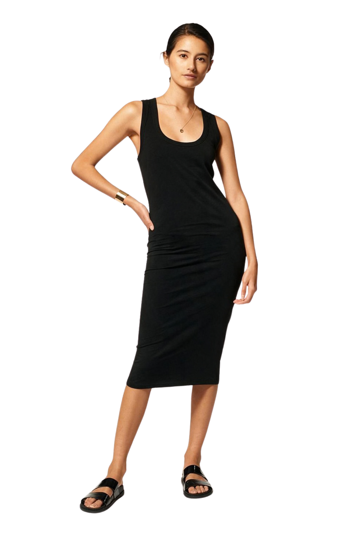 A woman modeling a sleeveless black ribbed midi dress with a scoop neckline, paired with black sandals, against a plain white background.