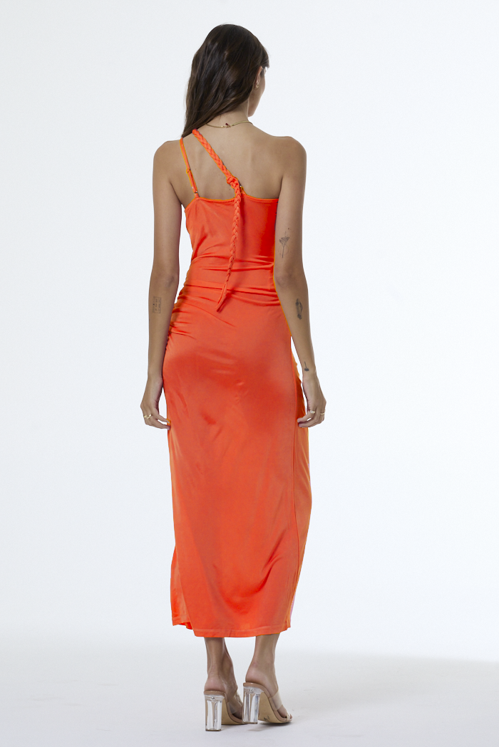 Woman wearing an orange dress on a white background