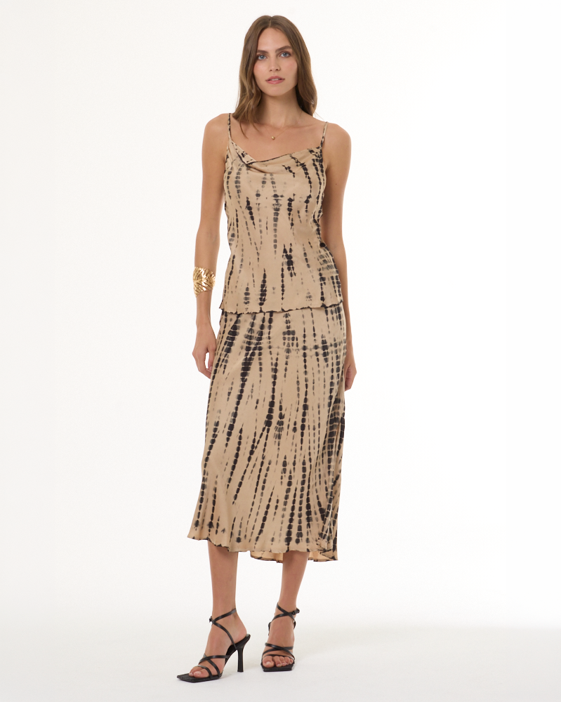 ADA compliant: Shop the Skirt collection. Woman wearing a black and tan printed satin pull on skirt and matching camisole.